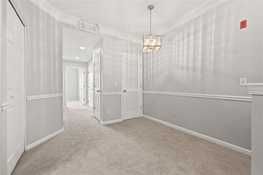 1752 Pryor Road Southwest, Unit 111 Atlanta, GA 30315 - Photo 9 of 20 a view of a chandelier fan and entryway