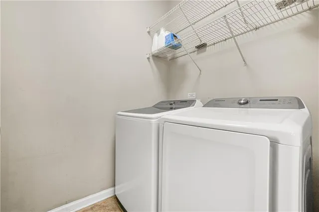 a spacious bedroom with a large bed and a window