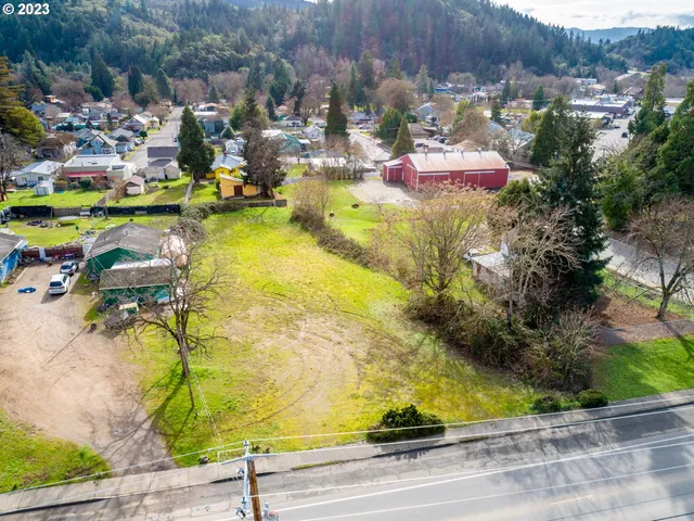 a view of swimming pool with a yard and mountain view