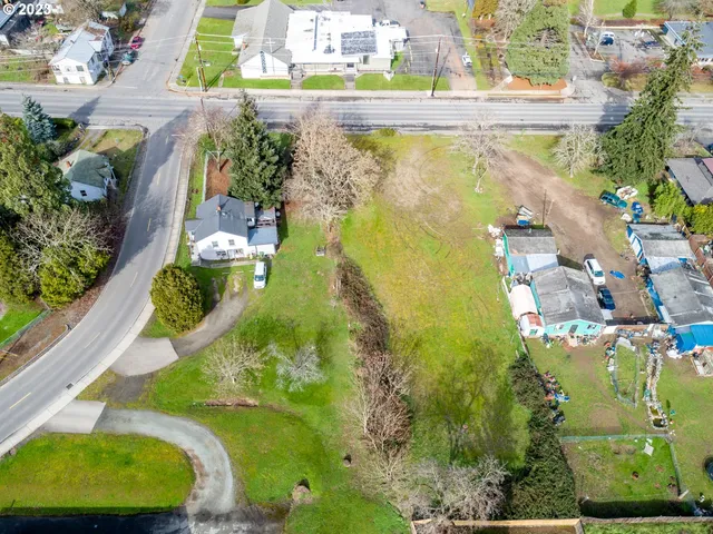 a view of a swimming pool with a yard