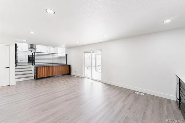 a view of a room with wooden floor and closet