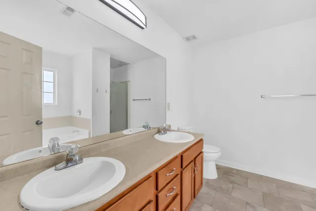 a white bath tub sitting in a bathroom