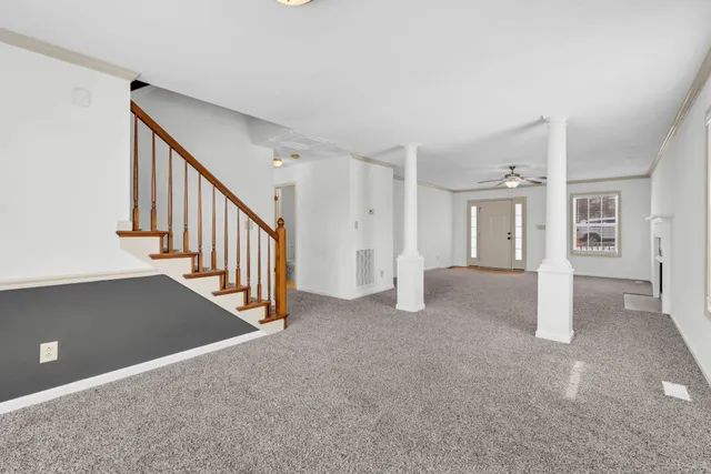 a view of a hallway with staircase
