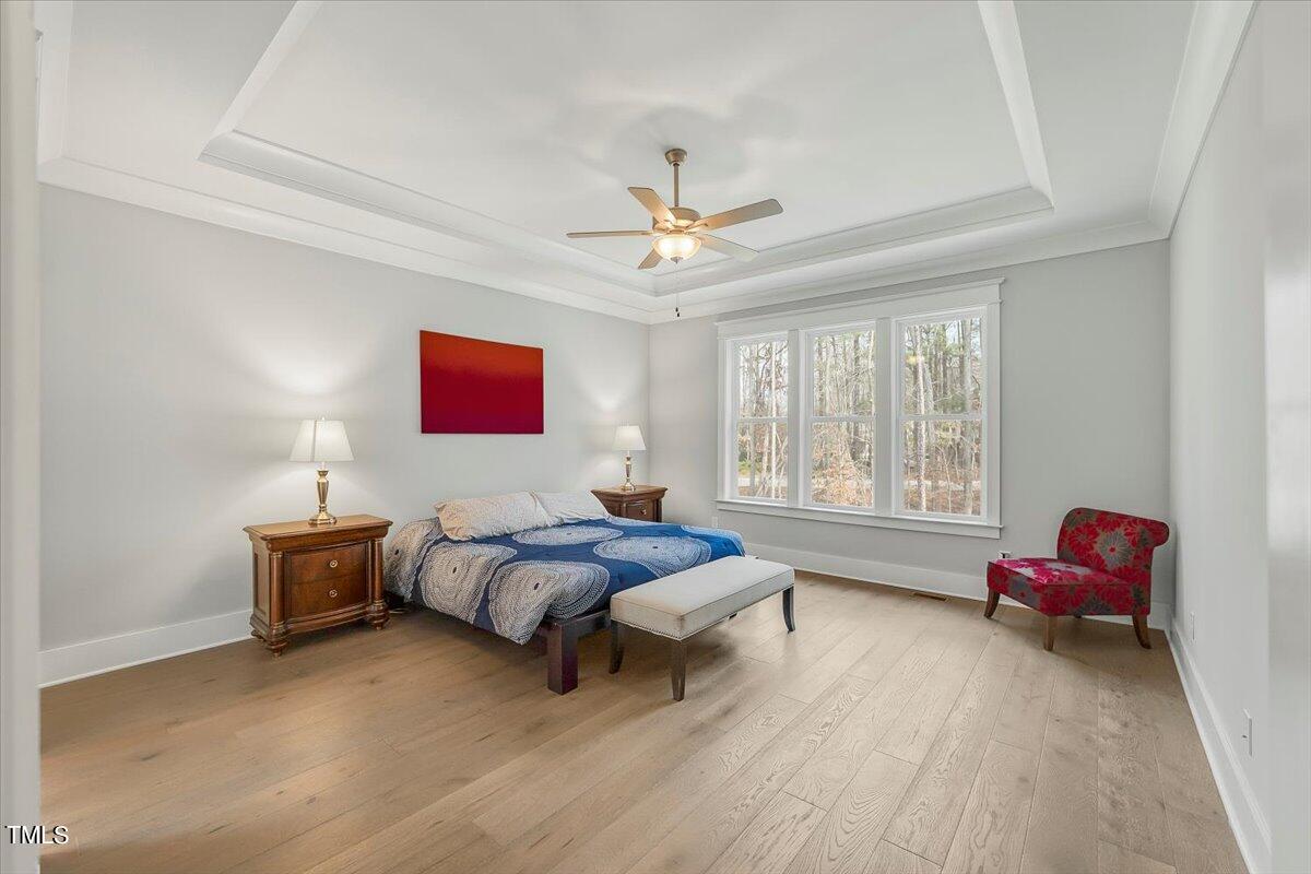 3812 Stoneridge Drive Raleigh, NC 27612 - Photo 16 of 46 a bed room with a bed and a couch