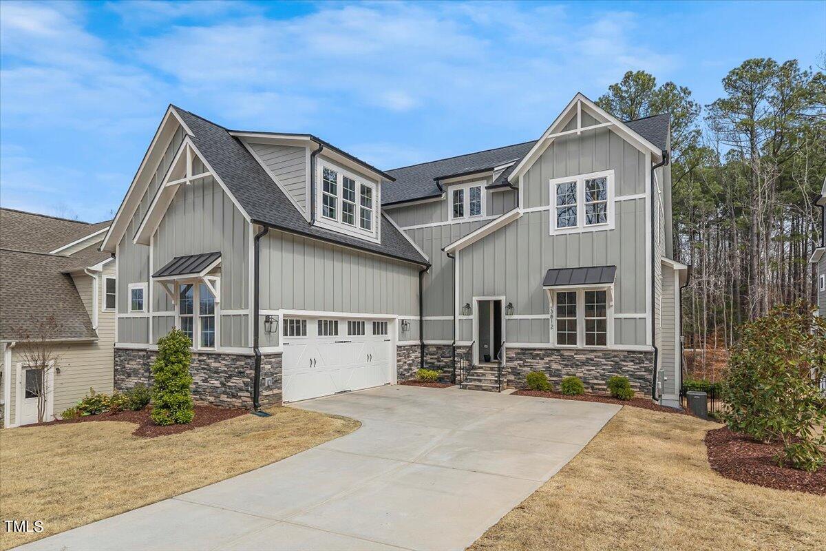 3812 Stoneridge Drive Raleigh, NC 27612 - Photo 2 of 46 a front view of a house with a yard