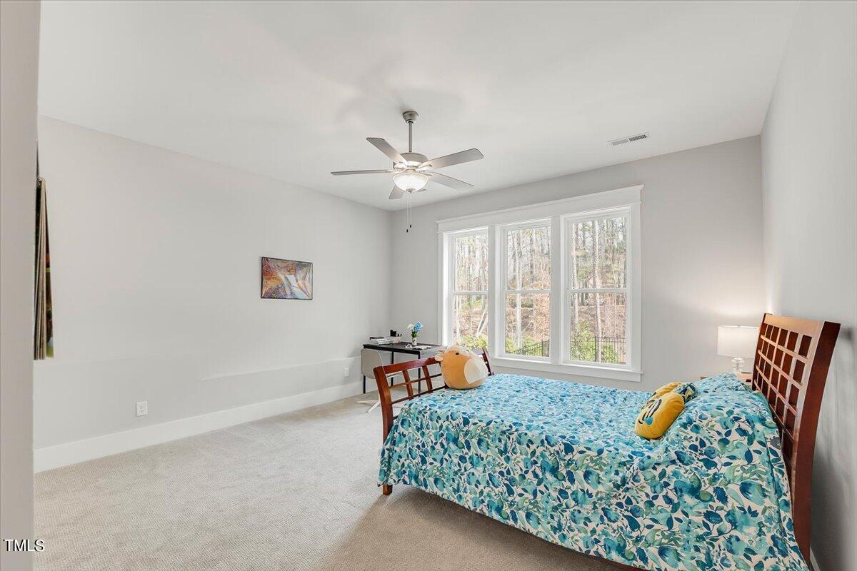 3812 Stoneridge Drive Raleigh, NC 27612 - Photo 40 of 46 a bedroom with furniture and a window