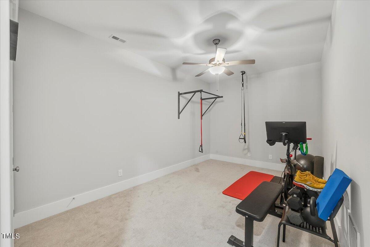 3812 Stoneridge Drive Raleigh, NC 27612 - Photo 43 of 46 a view of a room with gym equipment