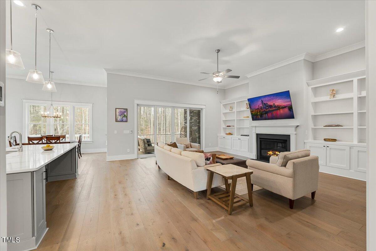 3812 Stoneridge Drive Raleigh, NC 27612 - Photo 5 of 46 a living room with fireplace furniture and a wooden floor