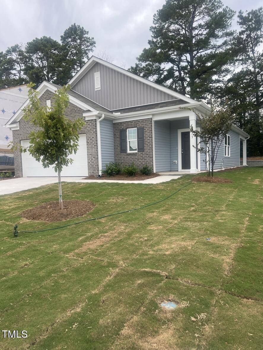 773 Shepard Rock Drive Zebulon, NC 27597 - Photo 2 of 43 a front view of a house with a yard