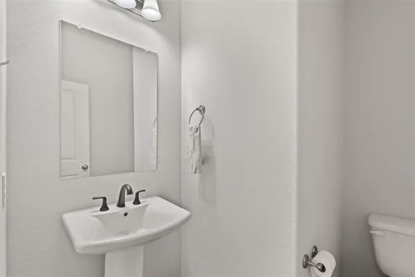 a kitchen with sink cabinets and stainless steel appliances