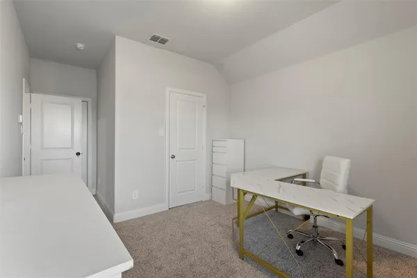 a view of a workspace with furniture