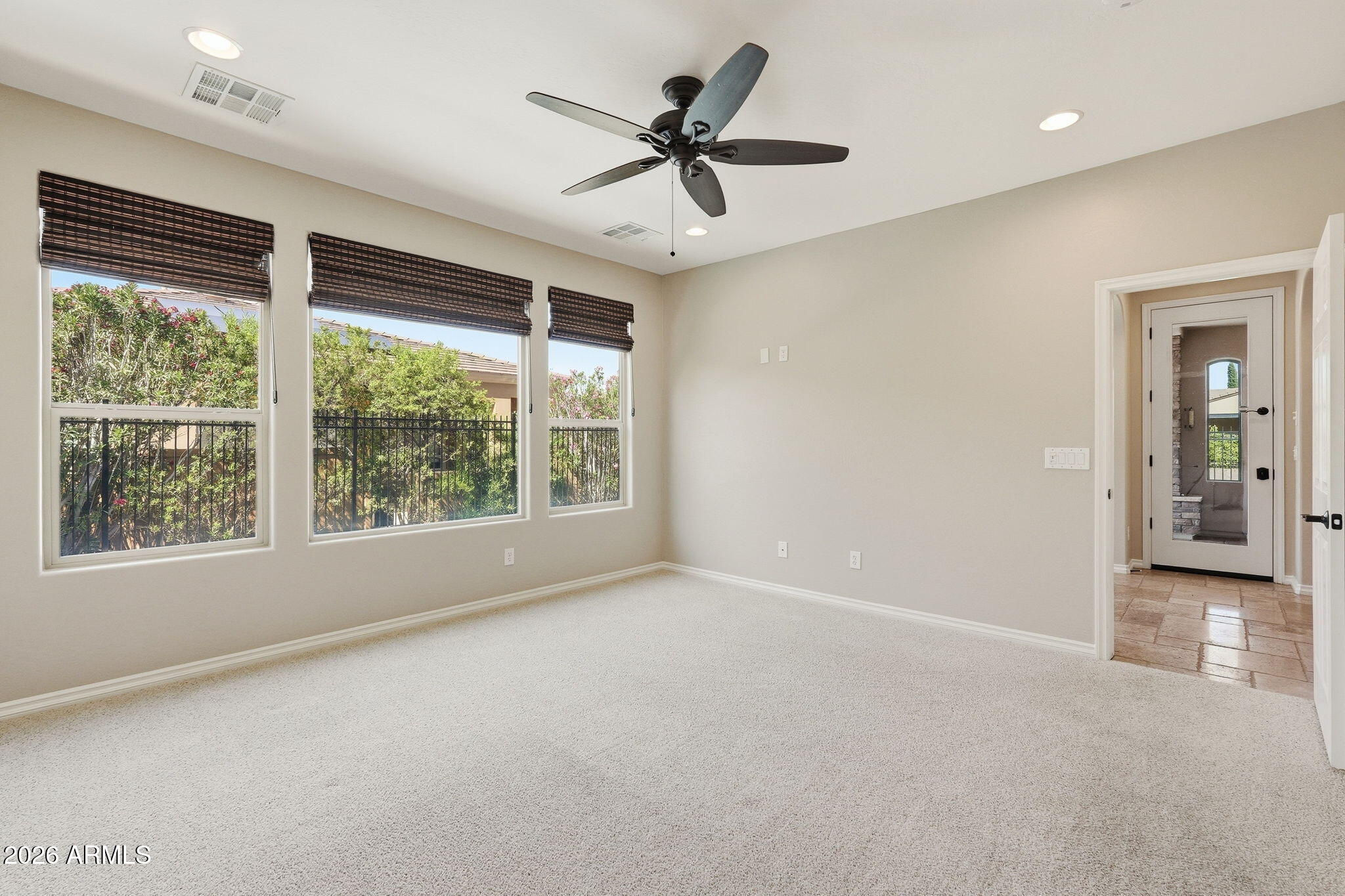 1694 East Grand Ridge Road Queen Creek, AZ 85140 - Photo 27 of 61 an empty room with windows and ceiling fan