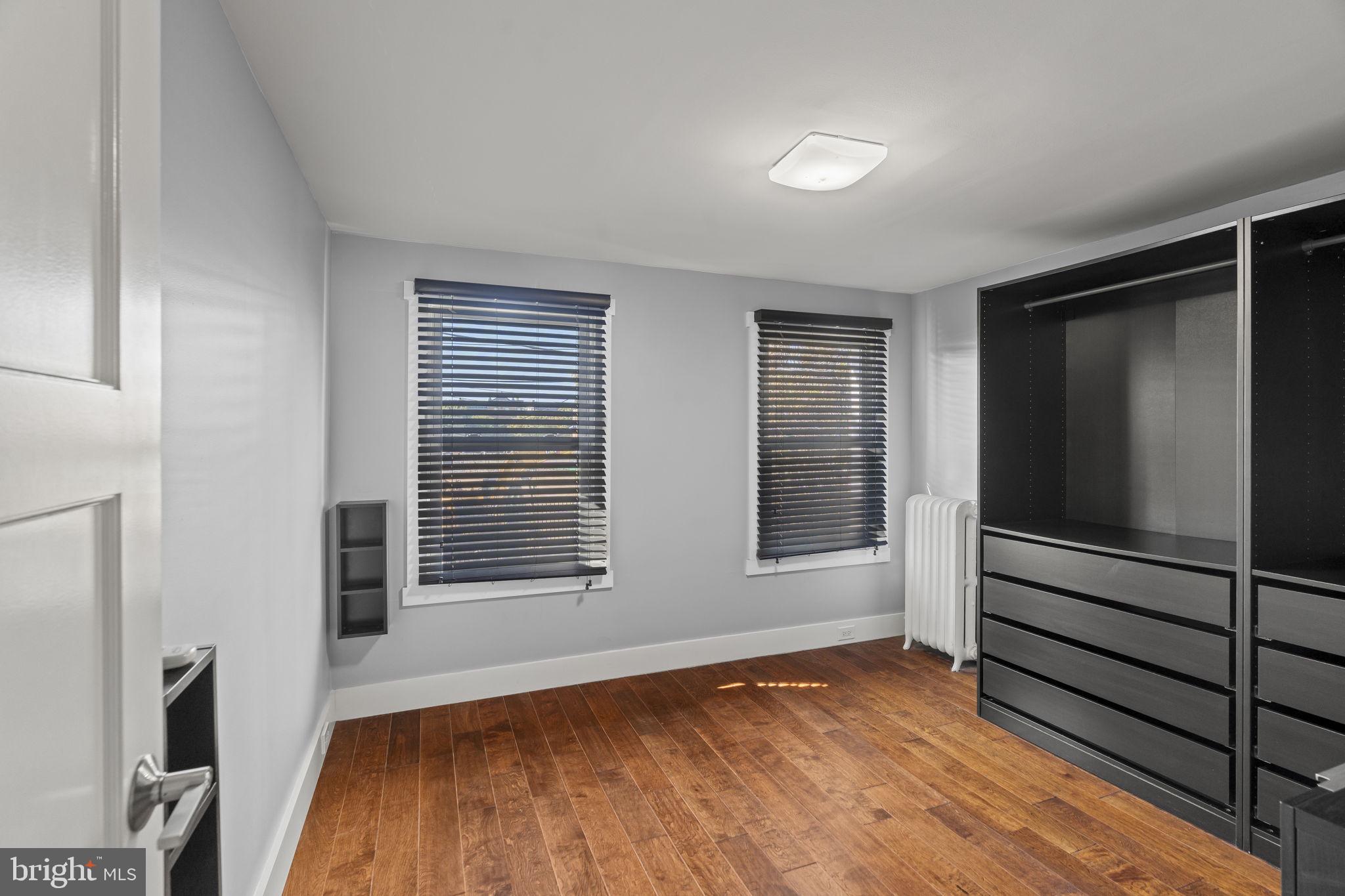 2173 East Hagert Street Philadelphia, PA 19125 - Photo 12 of 23 a view of an empty room with wooden floor and a window