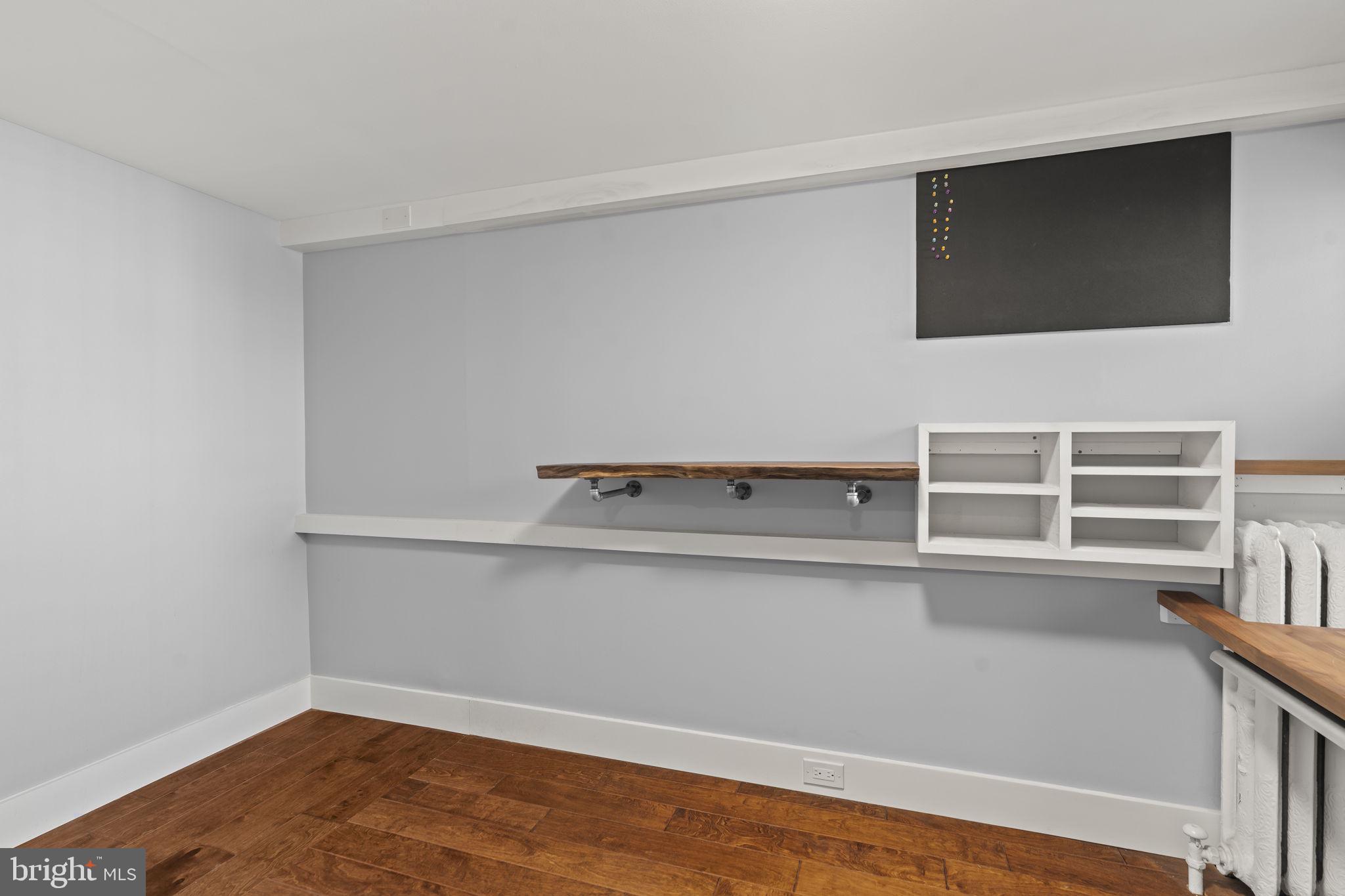 2173 East Hagert Street Philadelphia, PA 19125 - Photo 14 of 23 a view of an empty room with wooden floor and a window