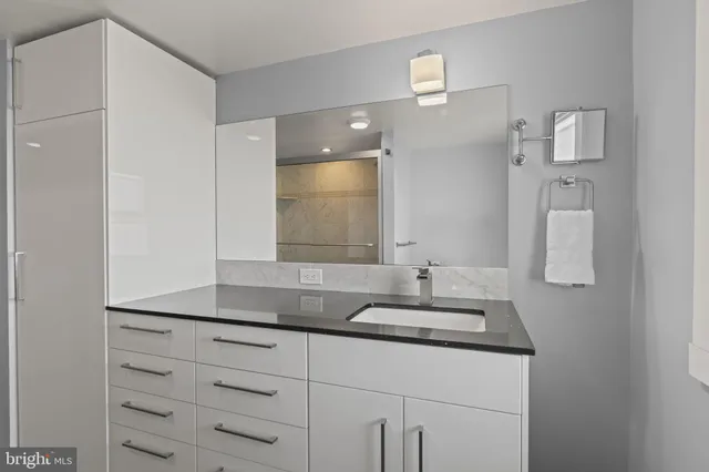 a bathroom with a sink and a mirror