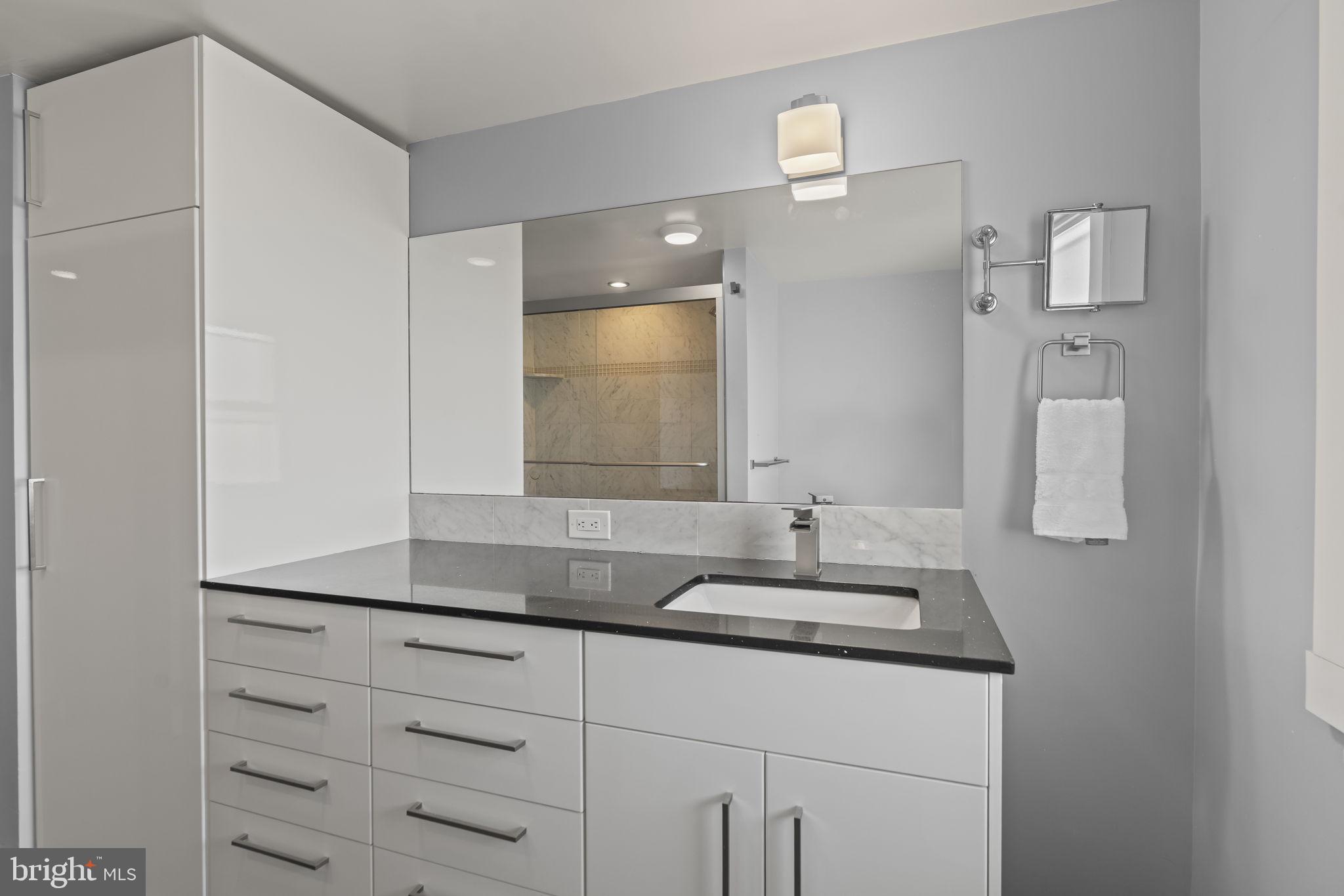 2173 East Hagert Street Philadelphia, PA 19125 - Photo 17 of 23 a bathroom with a sink and a mirror