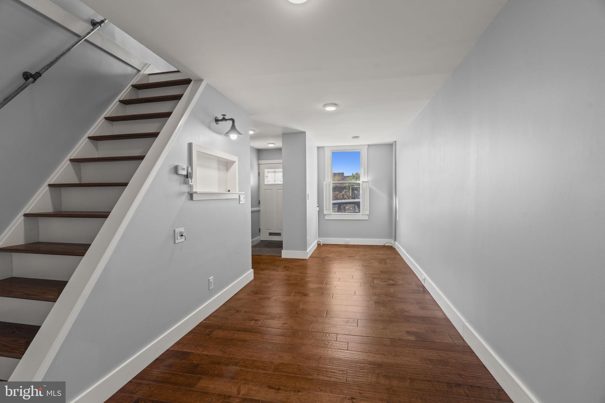 2173 East Hagert Street Philadelphia, PA 19125 - Photo 7 of 23 wooden floor in an empty room with wooden floor