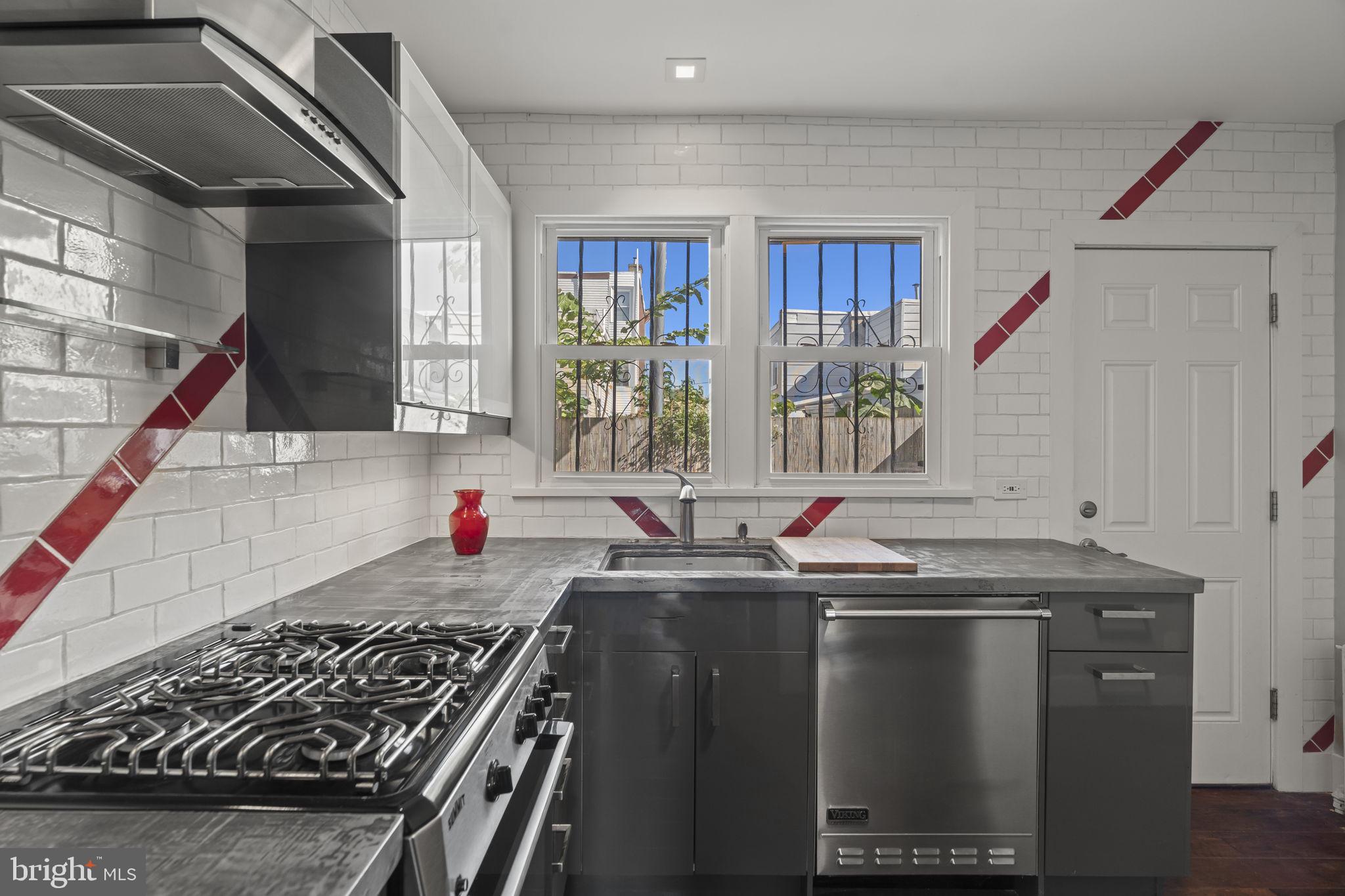 2173 East Hagert Street Philadelphia, PA 19125 - Photo 8 of 23 a kitchen with stainless steel appliances granite countertop a sink stove and cabinets