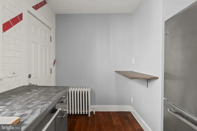 a view of entryway with wooden floor