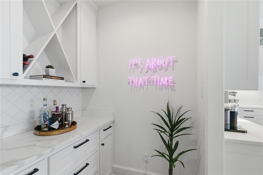 7754 Barber Rnch Road Fort Worth, TX 76126 - Photo 18 of 38 a view of a room with a potted plant on the wall and cabinets
