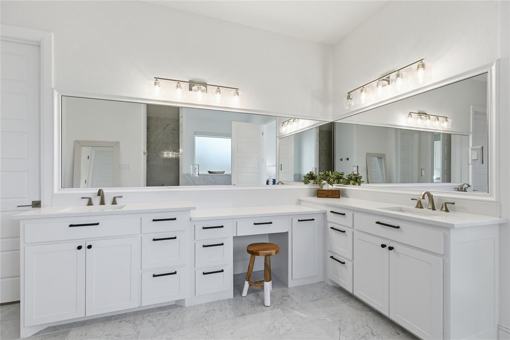 7754 Barber Rnch Road Fort Worth, TX 76126 - Photo 21 of 38 a spacious bathroom with a double vanity sink a mirror a vanity and