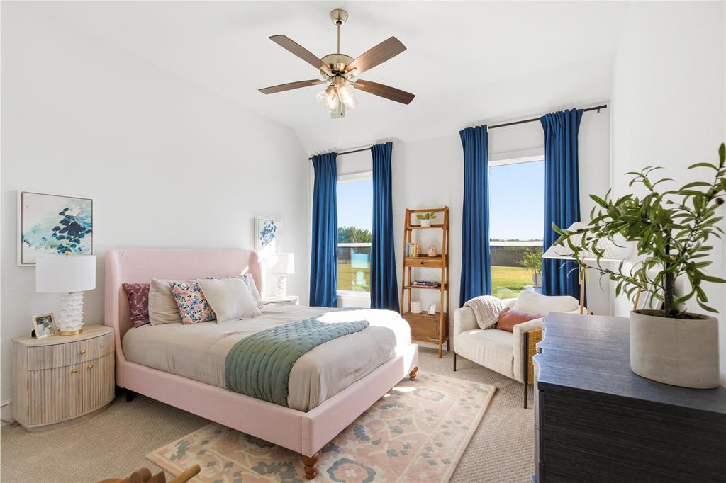 7754 Barber Rnch Road Fort Worth, TX 76126 - Photo 25 of 38 a bedroom with a large bed and a potted plant