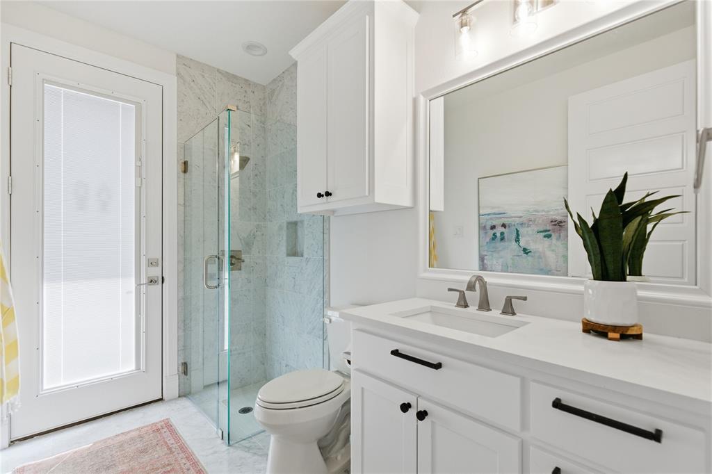 7754 Barber Rnch Road Fort Worth, TX 76126 - Photo 26 of 38 a bathroom with a sink a toilet and shower