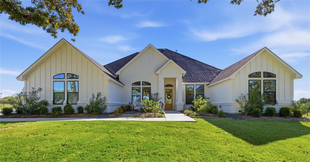 7754 Barber Rnch Road Fort Worth, TX 76126 - Photo 3 of 38 a front view of house with yard and green space