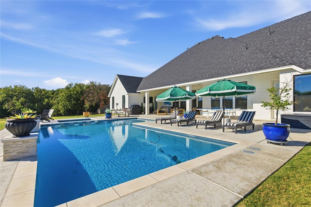 7754 Barber Rnch Road Fort Worth, TX 76126 - Photo 33 of 38 a view of a patio with swimming pool table and chairs