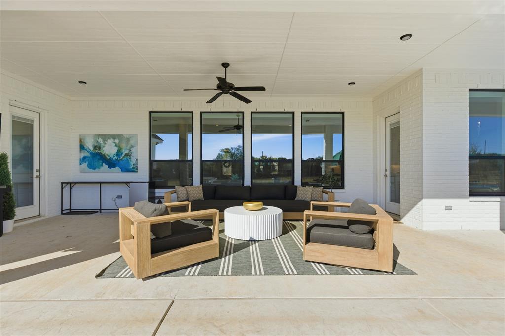 7754 Barber Rnch Road Fort Worth, TX 76126 - Photo 35 of 38 a living room with furniture and large windows