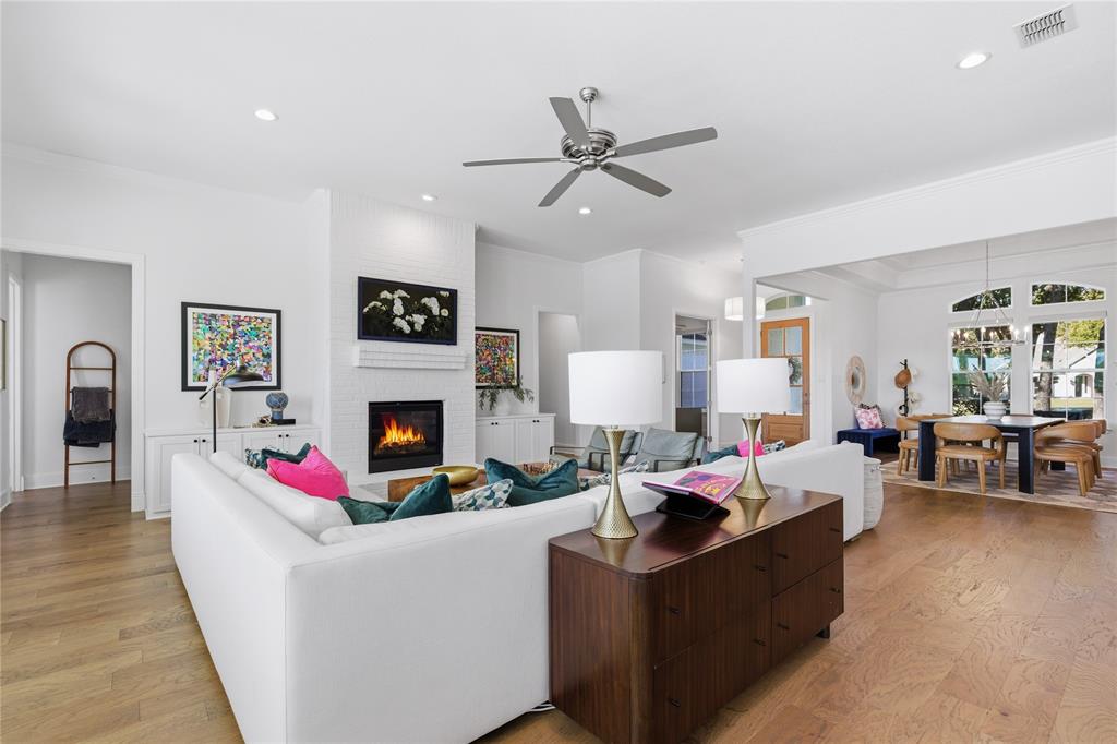 7754 Barber Rnch Road Fort Worth, TX 76126 - Photo 8 of 38 a living room with furniture a fireplace and a flat screen tv