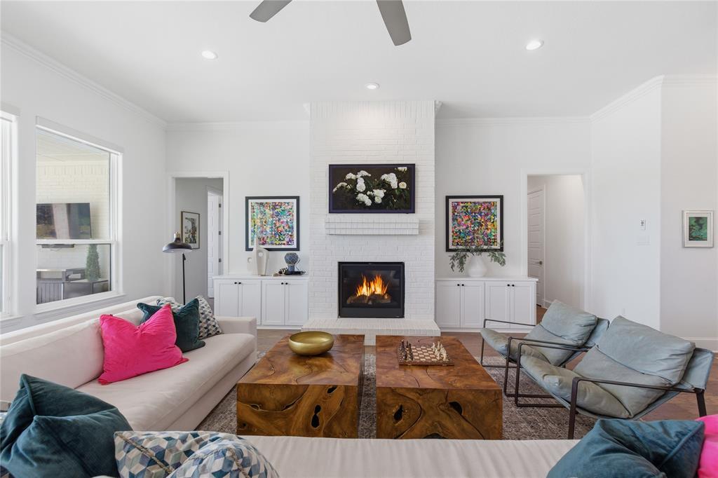 7754 Barber Rnch Road Fort Worth, TX 76126 - Photo 9 of 38 a living room with furniture and a fireplace