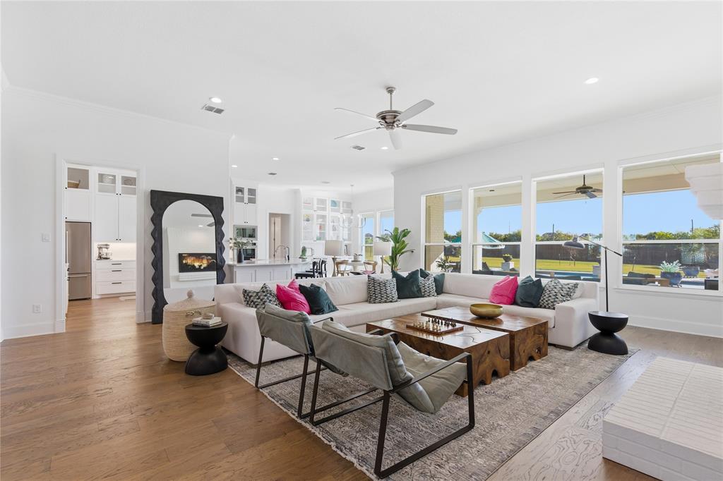 7754 Barber Rnch Road Fort Worth, TX 76126 - Photo 10 of 38 a living room with furniture fireplace and a large window
