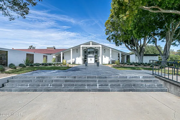 a view of a house with a swimming pool