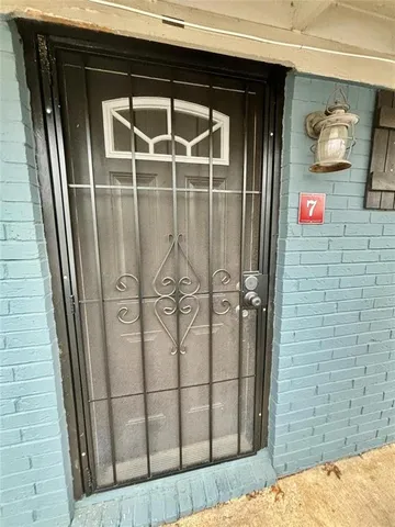 a bathroom with a shower and a sink