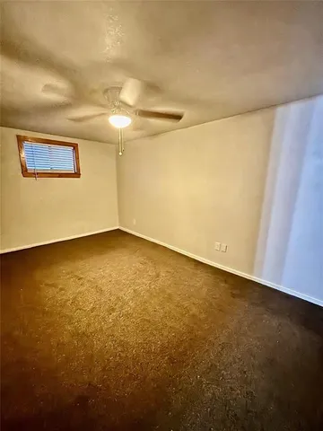 an empty room with a empty space and a window