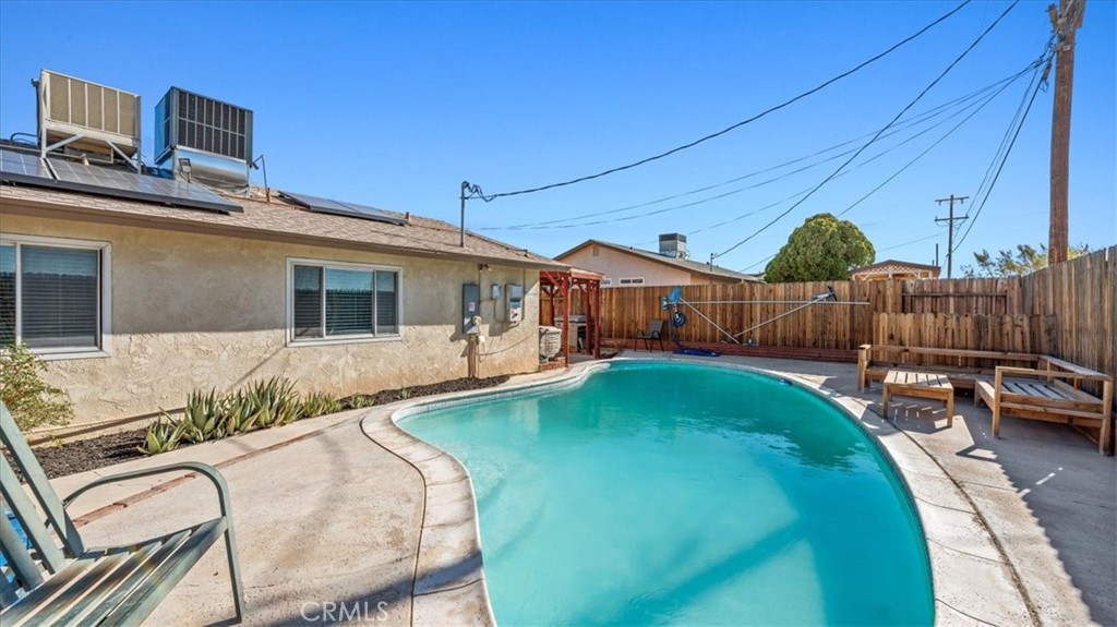 25607 Ash Road Barstow, CA 92311 - Photo 28 of 36 a front view of a house with garden