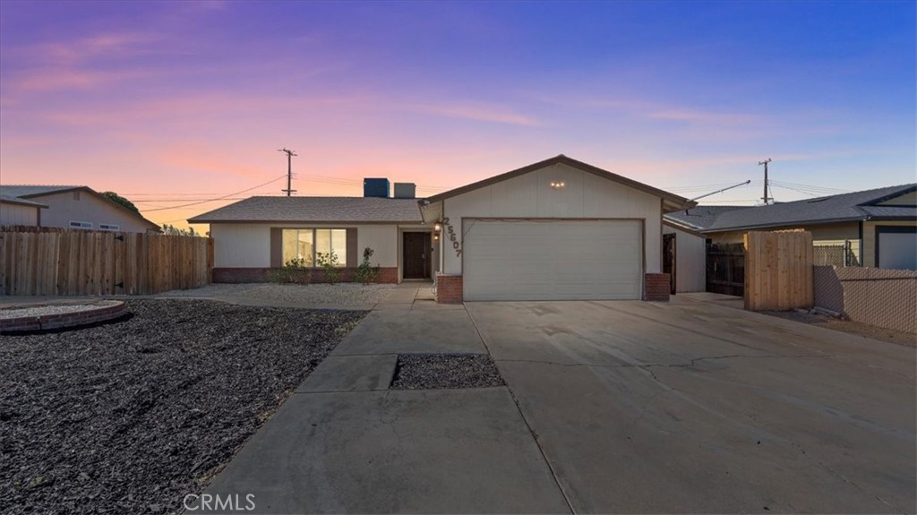 25607 Ash Road Barstow, CA 92311 - Photo 3 of 36 a front view of a house with a yard
