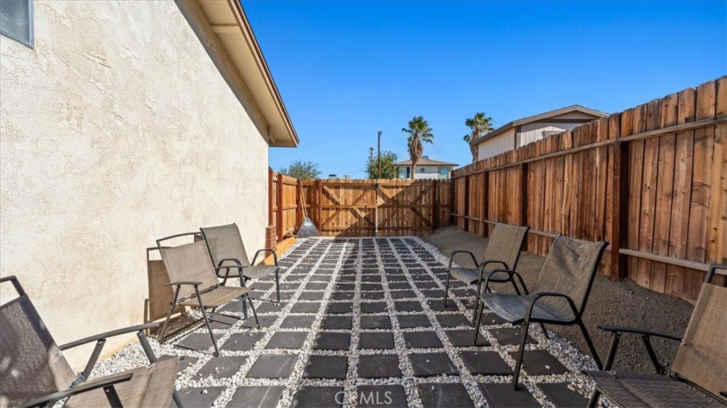 25607 Ash Road Barstow, CA 92311 - Photo 31 of 36 a view of a backyard with sitting area