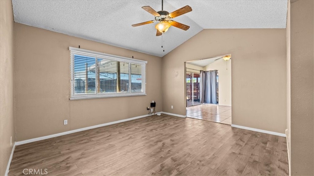 25607 Ash Road Barstow, CA 92311 - Photo 5 of 36 a view of empty room with wooden floor and fan