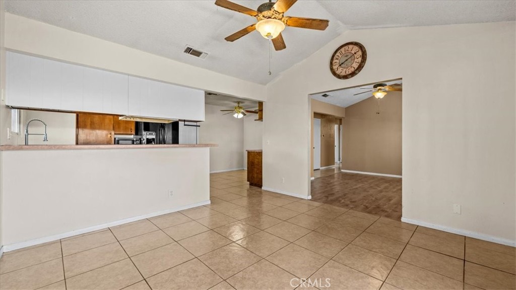 25607 Ash Road Barstow, CA 92311 - Photo 9 of 36 a view of a kitchen cabinets and a stove top oven