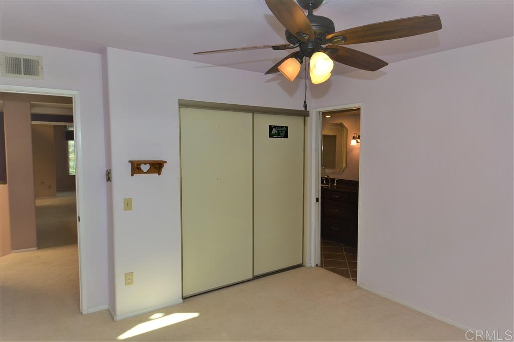 5050 Frazee Road Oceanside, CA 92057 - Photo 15 of 25 At the far end of the landing from the Master we find Guest Bedroom number one with Decorator Fan, Double Closet, cross ventilation and access to the Jack and Jill Bath. All four bedrooms in the home have access to a private bath.