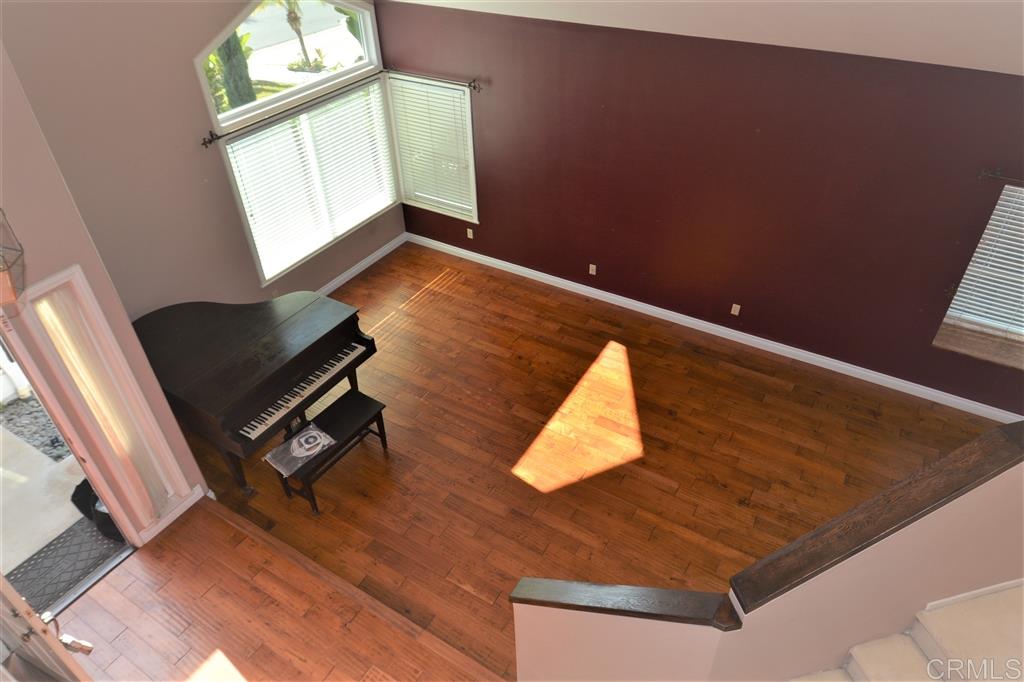 5050 Frazee Road Oceanside, CA 92057 - Photo 18 of 25 At the top of the stairs is a wonderful landing space that affords this view of the Spacious Living Room that is flooded with light.