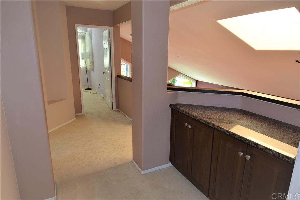 5050 Frazee Road Oceanside, CA 92057 - Photo 19 of 25 The wide open second floor Landing give a feeling of spaciousness.... yet coziness, aided by the light flooding skylight. The granite topped Linen storage creates an inviting entry to the Huge Master Suite and Master Bath.