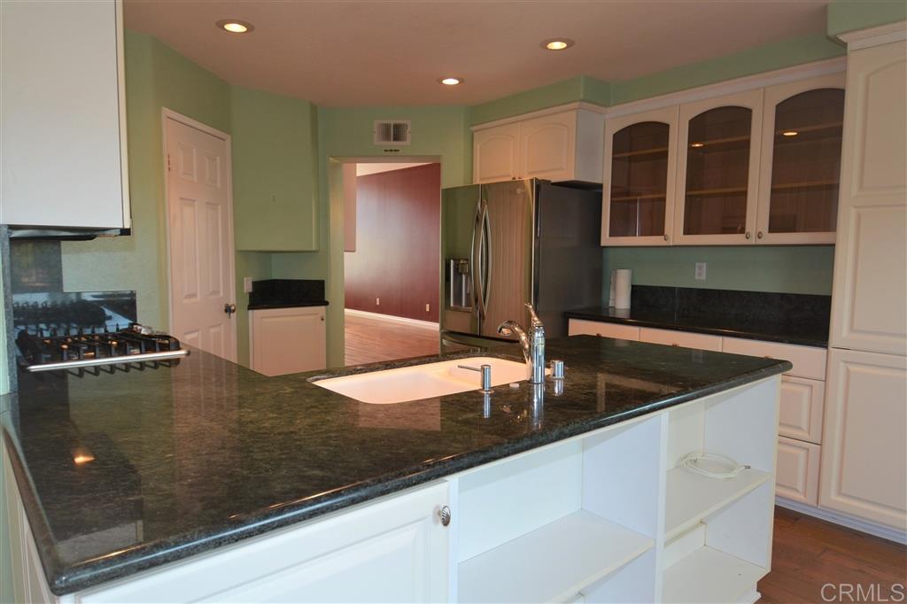 5050 Frazee Road Oceanside, CA 92057 - Photo 3 of 25 Here we have a wonderful view of the spacious counter tops and the tons of storage. Roller glide drawers, below the glass paned Hutch... and a massive Pantry cabinet in addition to the Walk In Pantry