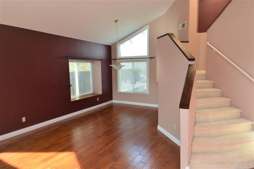 5050 Frazee Road Oceanside, CA 92057 - Photo 6 of 25 As soon as we step inside the gorgeous formal entry.. we find stunning Hardwood Flooring throughout the main level... and a Beautiful staircase angling up to the second level landing.