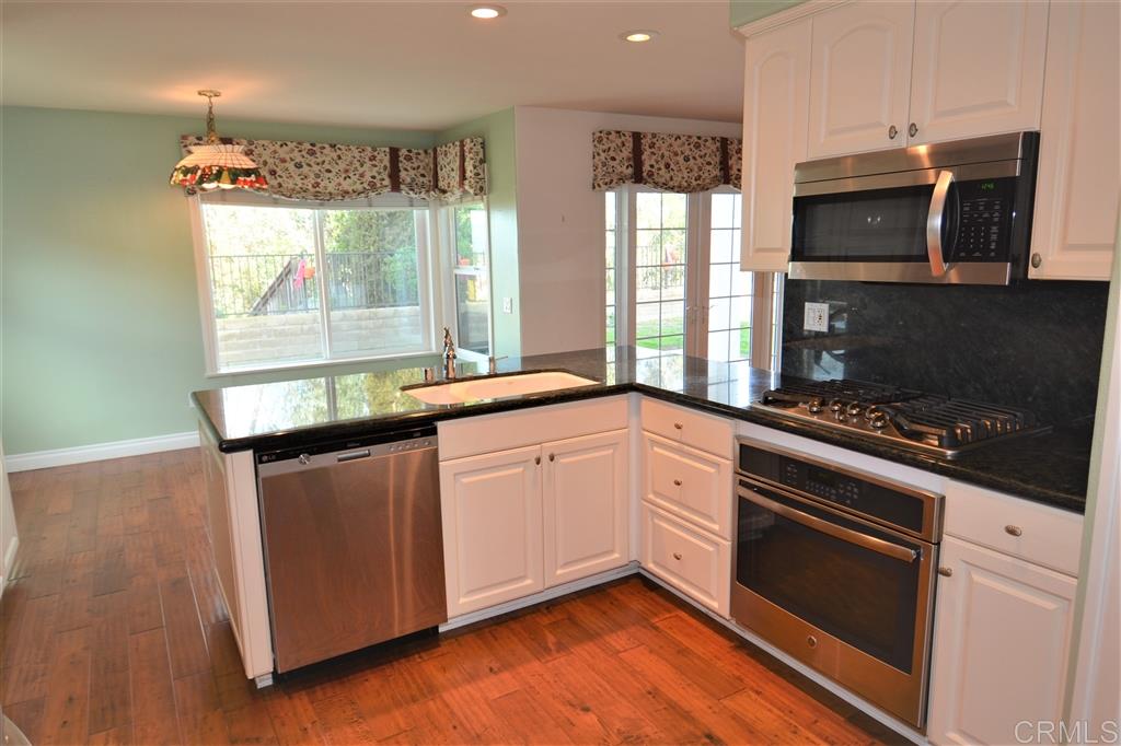 5050 Frazee Road Oceanside, CA 92057 - Photo 8 of 25 Acres of counter top work space, new appliances, and all flooded with Natural light from the truly private serene back yard. Old Florescent lighting has been replaced with contemporary canned lighting.