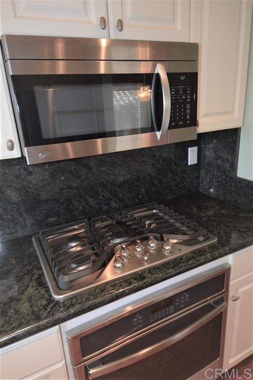 5050 Frazee Road Oceanside, CA 92057 - Photo 9 of 25 All new GE Profile appliances. Microwave Hood, five burner gas Cook top, and a spacious full width Oven. All surrounded by elegant Granite Counters and Splash back.