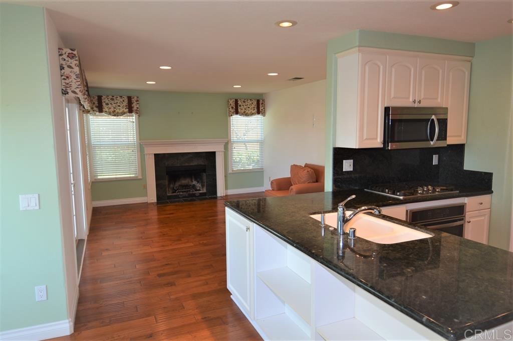 5050 Frazee Road Oceanside, CA 92057 - Photo 25 of 25 Here is why this is a most desirable floor plan: The Chef is the center of ever party. Every party will end up centered around this corner. All enjoy the fireplace, all the storage space of dreams, and all flooded with natural light.