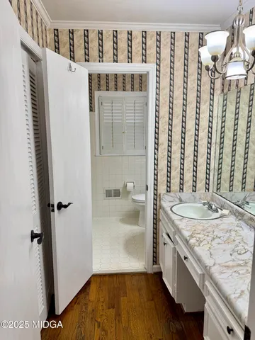 a bathroom with a toilet a sink and bathtub